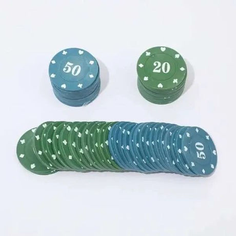 Fanned row of blue and green poker chips laid out behind two short stacks