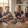 Friends playing poker at a table with the chip tin, loose chips and playing cards