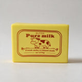 Yellow butter block squishy with a red Pure Milk label and a cow illustration