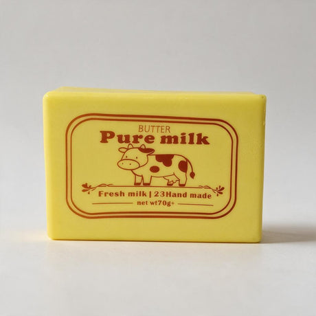 Yellow butter block squishy with a red Pure Milk label and a cow illustration
