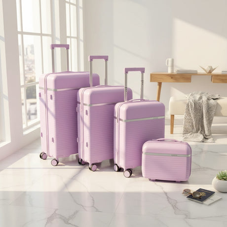 Purple hard shell luggage set of four with a vanity case
