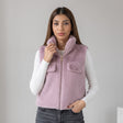 Lilac faux fur vest with flap chest pockets over a white long sleeve top