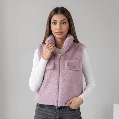 Lilac faux fur vest with flap chest pockets over a white long sleeve top