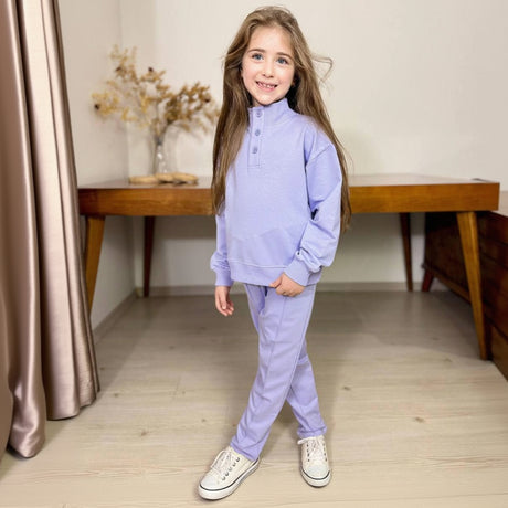 Girl in a lilac button placket sweatshirt and matching pants