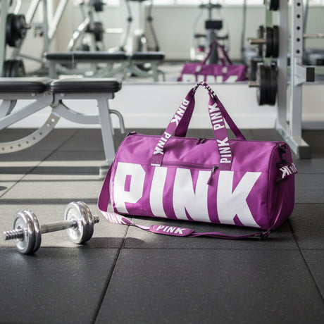 Berry purple gym duffel bag with a bold logo on a grey background