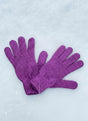 Violet knitted kids gloves spread out on snow