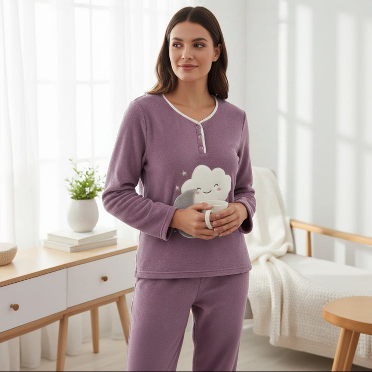 Purple fleece pyjama top with a piped three button neckline, worn holding a white mug