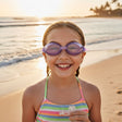 Girl wearing purple kids swim goggles on the sand, Jack Gifts Online Lebanon