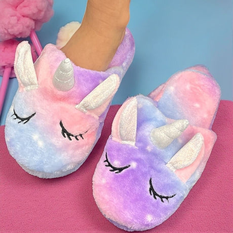 Pastel purple unicorn mule slippers with a silver ridged horn and sparkly ears