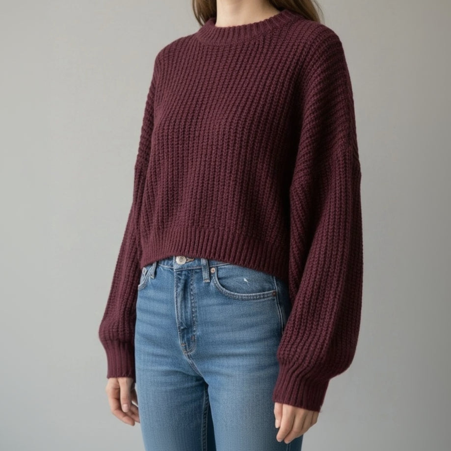 Deep plum boxy sweater in ribbed knit, slightly cropped over blue jeans
