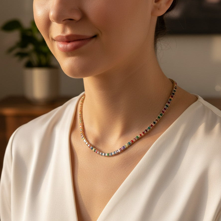 Woman wearing a colorful beaded necklace in a warm indoor setting