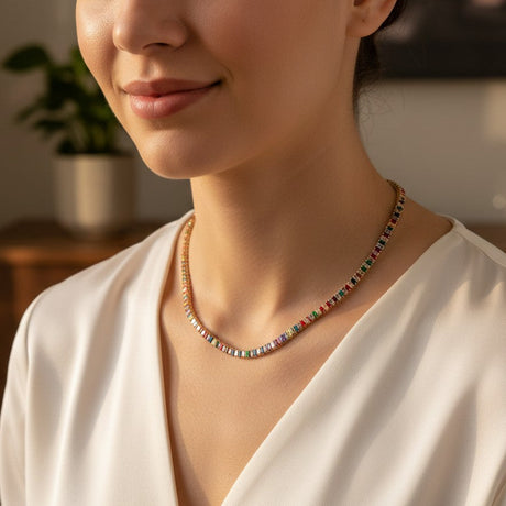 Woman wearing a colorful beaded necklace in a warm indoor setting