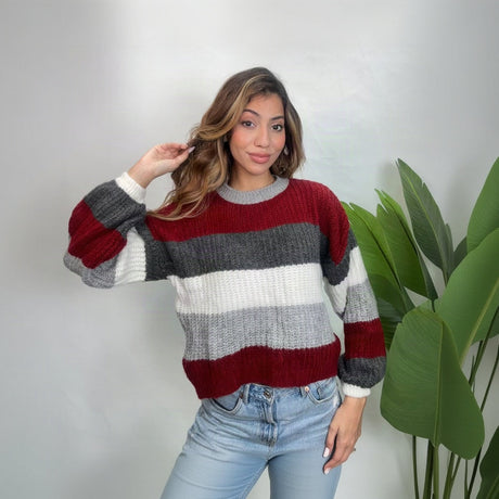 Red, charcoal, white and grey colour block striped knit sweater with balloon sleeves and jeans