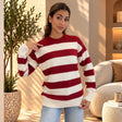 Red and white wide striped wool sweater with relaxed sleeves and jeans