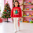 Girl in a red Festive Friends Christmas sweatshirt with cream lettered leggings in a playroom