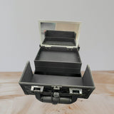 Vanity case shown open with a lid mirror, one full width tray and side wings folded out