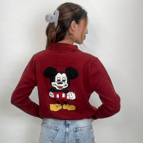 Burgundy red cardigan from behind with an embroidered cartoon character on the back