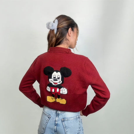 Back view of a red collared knit cardigan with a cartoon mouse patch