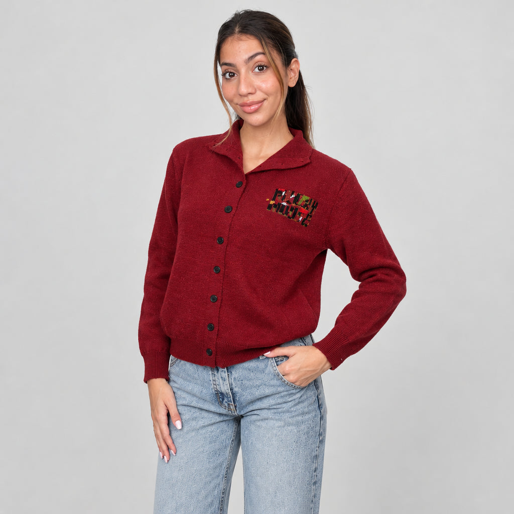 Red polo collar button cardigan with a small chest patch, worn with jeans