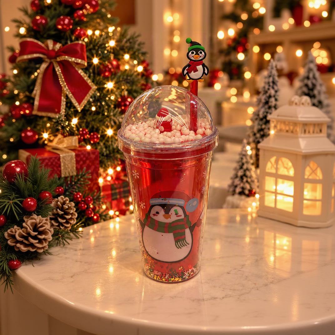 Red dome lid straw cup with a penguin print, white beads in the lid and a penguin straw topper
