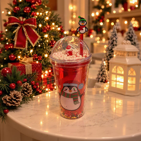 Red dome lid straw cup with a penguin print, white beads in the lid and a penguin straw topper