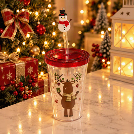 Clear straw tumbler with a reindeer print, red screw lid and a snowman straw topper