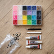 Rhinestone craft kit with 24 colour compartments, three glue tubes and tweezers