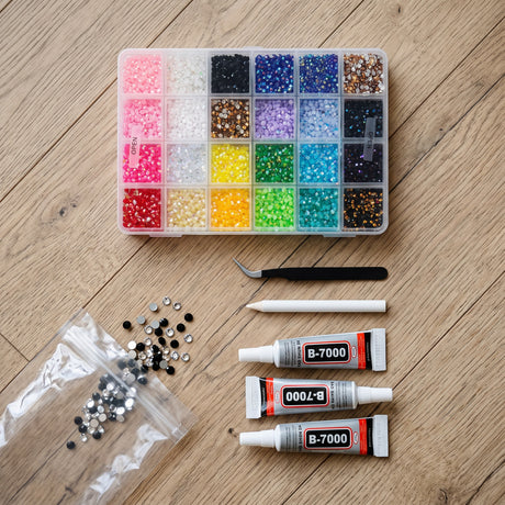 Rhinestone craft kit with 24 colour compartments, three glue tubes and tweezers