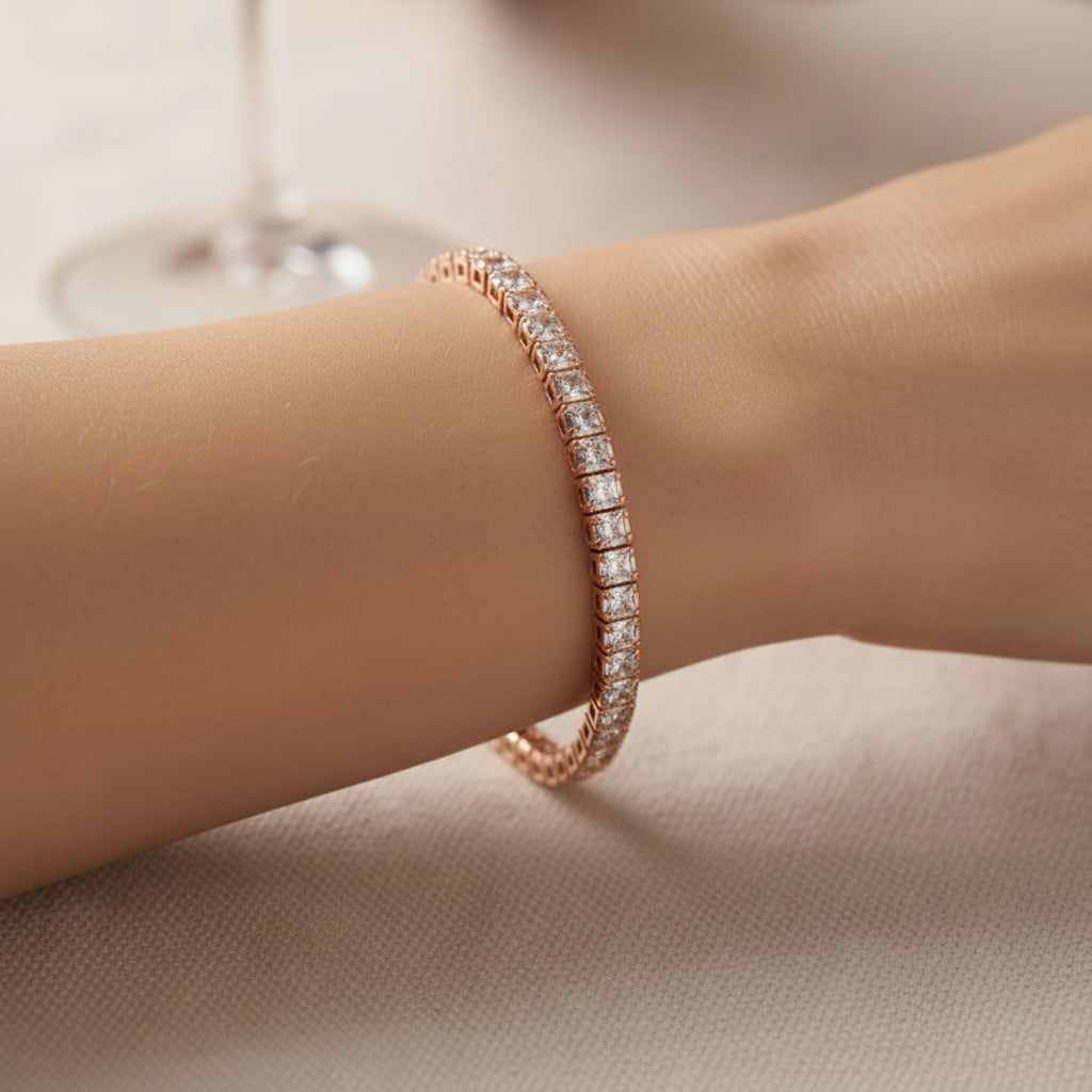 Rose gold square bracelet with diamonds on a wrist against a neutral background