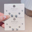 Three pairs of round crystal solitaire stud earrings in graduated sizes, Jack Gifts Online Lebanon