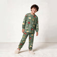Smiling boy in a sage green long sleeve pajama set with colourful car and truck print