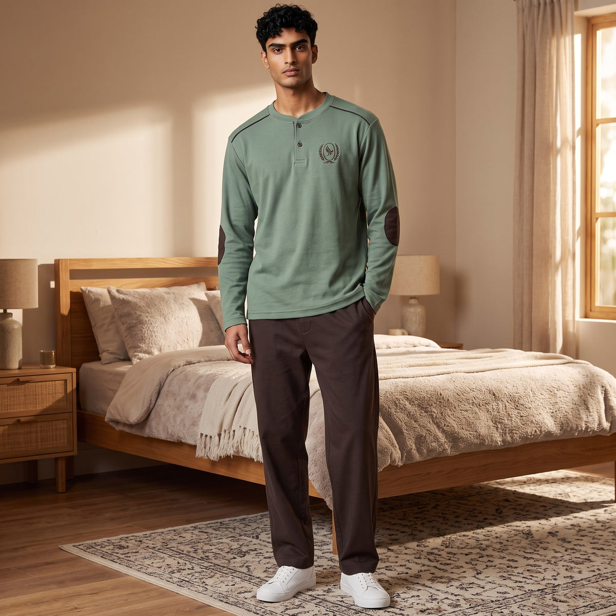 Men's sage green henley pyjama top with brown elbow patches and dark brown bottoms