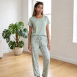 Full length sage green pyjama set with floral vine print straight leg trousers