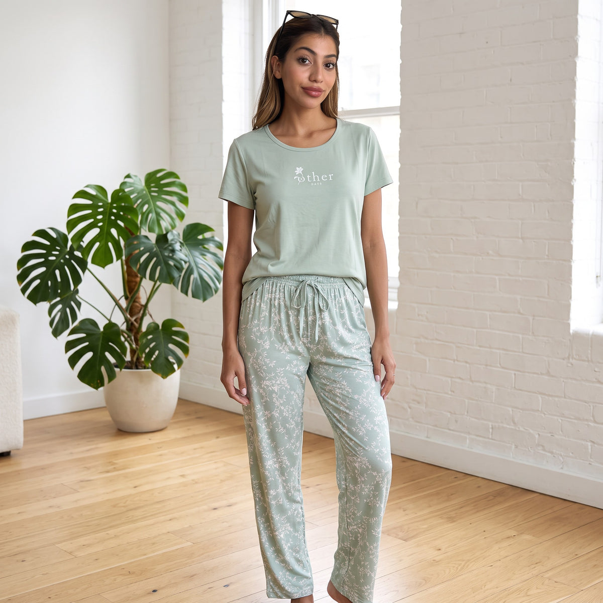 Full length sage green pyjama set with floral vine print straight leg trousers