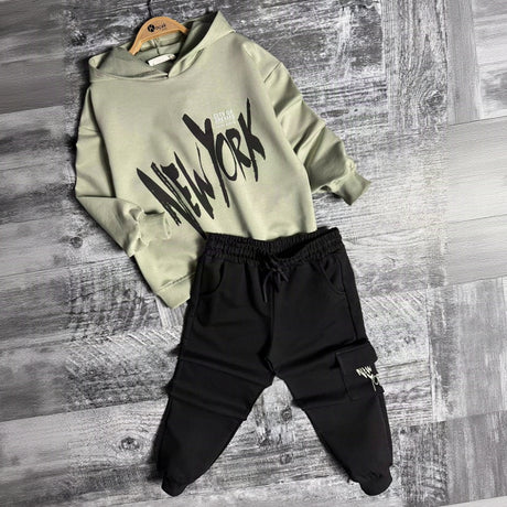 Sage New York hoodie and black cargo joggers on hangers