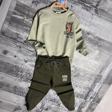 Sage tiger sweatshirt and olive joggers on hangers, front view