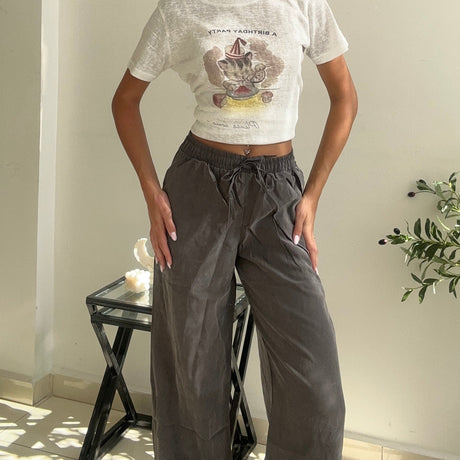 Sailboat print crop tee shown full length with grey drawstring trousers