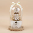 Pearls draped across the saint's open book over an ornate black and gold cross