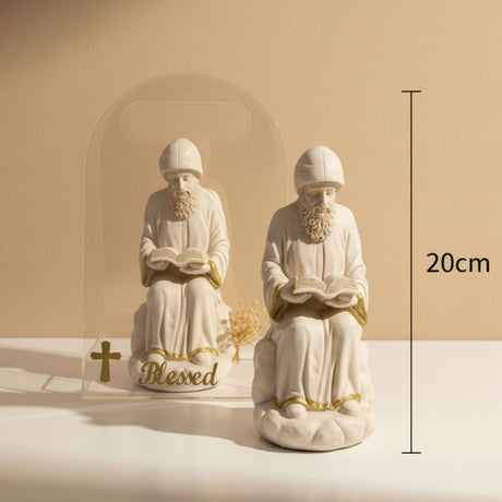 Two seated reading monks and a clear arch lettered Blessed in gold, marked 20cm
