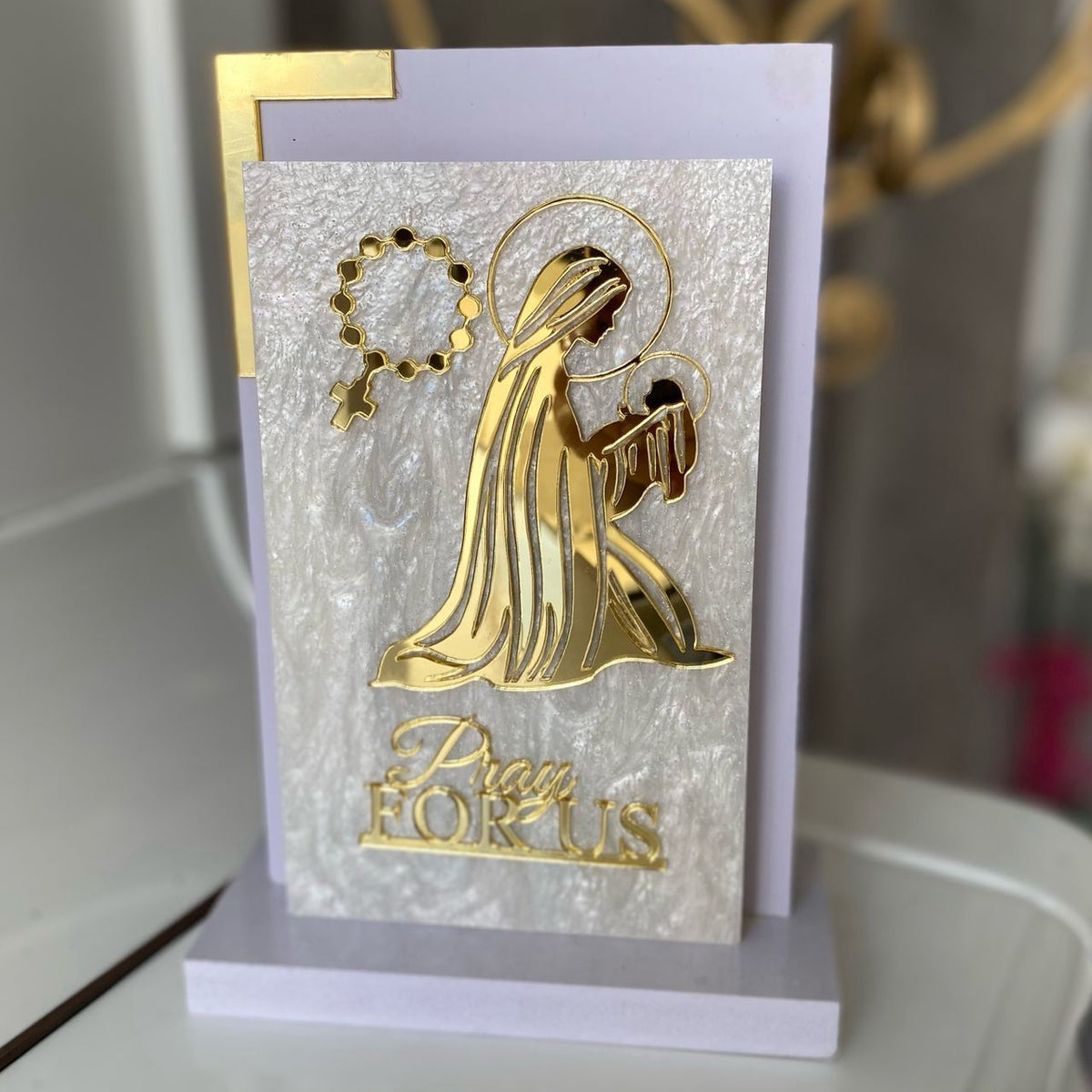 Haloed Virgin cradling the haloed infant Jesus above the words Pray For Us