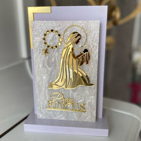Haloed Virgin cradling the haloed infant Jesus above the words Pray For Us