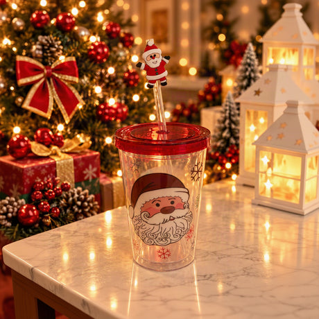 Clear straw tumbler with a large Santa face print, red lid and a Santa straw topper