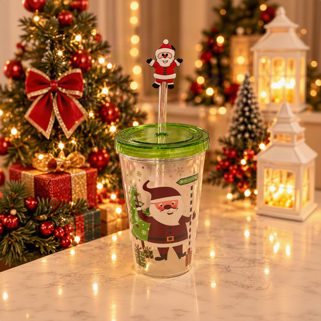 Clear straw tumbler with a Santa print, green lid and a Santa straw topper