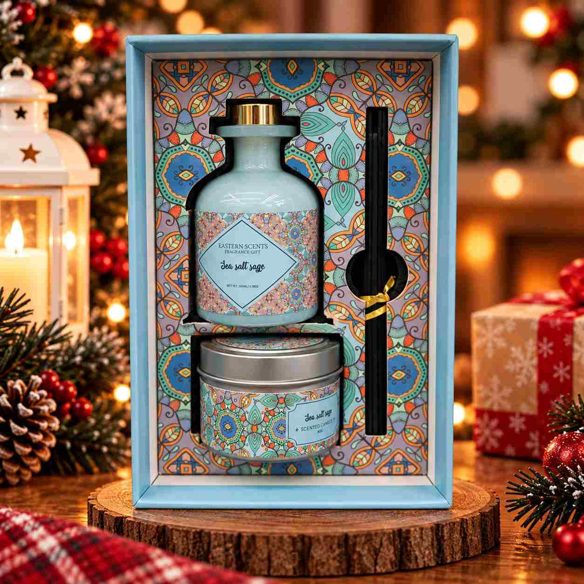 Sea salt sage reed diffuser and tin candle with reed sticks in a light blue mandala print box