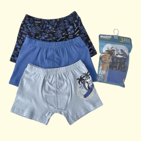 Three boys boxer shorts in navy, blue and white with a surfing motif and retail pack