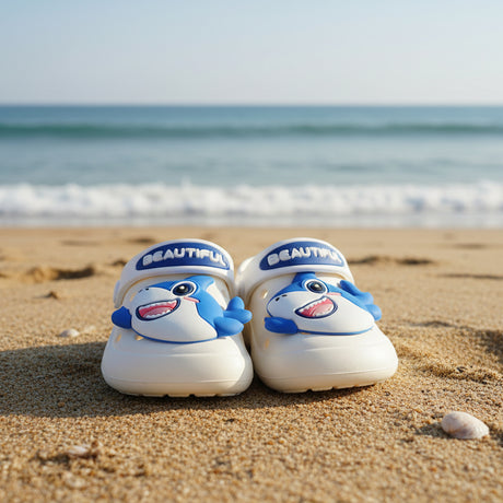 Children's sandals with shark design and 'BEAUTIFUL' text on a white surface