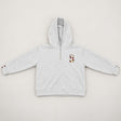 Flat lay of a grey marl hoodie with a quarter zip and small embroidered chest patch