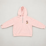 Blush pink hoodie flat on a plain background with its silver zip pulled halfway