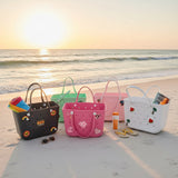 Colorful beach bags on a sandy beach with ocean view