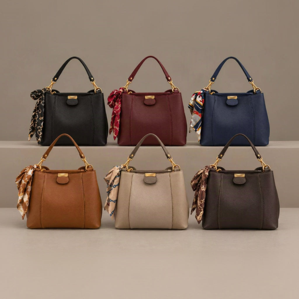 Six top handle bags in black, burgundy, navy, camel, beige and dark brown with tied scarves on grey steps